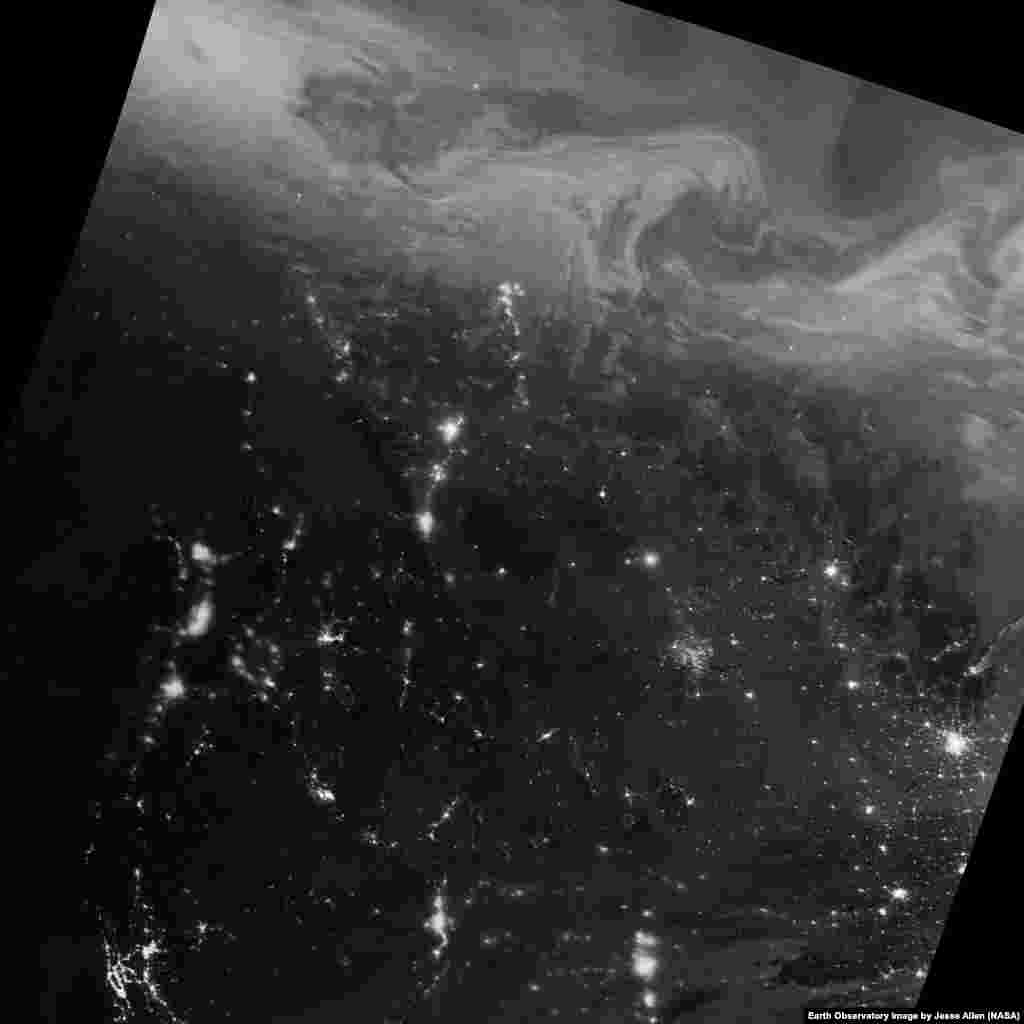 With the “day-night band” (DNB) of the Visible Infrared Imaging Radiometer Suite (VIIRS), the Suomi NPP satellite acquired this view of the aurora borealis on Dec. 22, 2016. The northern lights stretched across British Columbia, Alberta, Saskatchewan, Manitoba, Nunavut, and Northwest Territories, areas that often fall under the auroral oval.