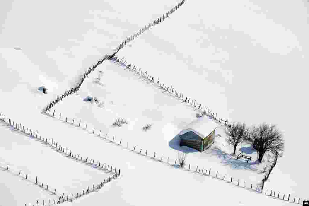 A wooden cottage is covered in snow in the Talesh mountains, close to the Caspian Sea, some 262 miles (430 kilometers) northeast of Tehran, Iran.
