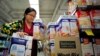 Chinese "daigou" shopping agent Na Wang selects an Australian breakfast cereal product popular in China, during a shopping trip for Chinese customers at an Australian supermarket in Sydney, Australia, Aug. 2, 2016.