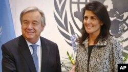 Former South Carolina Governor Nikki Haley poses with U.N. Secretary General Antonio Guterres after presenting him with her credentials as the new U.S. ambassador to the United Nations at U.N. headquarters, Jan. 27, 2017. 