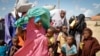 FILE - Somalis fleeing from drought in the Lower and Middle Shabelle regions of the country reach a makeshift camp for displaced persons in the Daynile neighborhood on the outskirts of the capital Mogadishu, May 18, 2019. 
