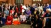 A group of New Zealand women lawmakers featuring Prime Minister Jacinda Ardern in the center holding baby Neve pose for a photograph at Parliament, Sept. 19, 2018, in Wellington. 