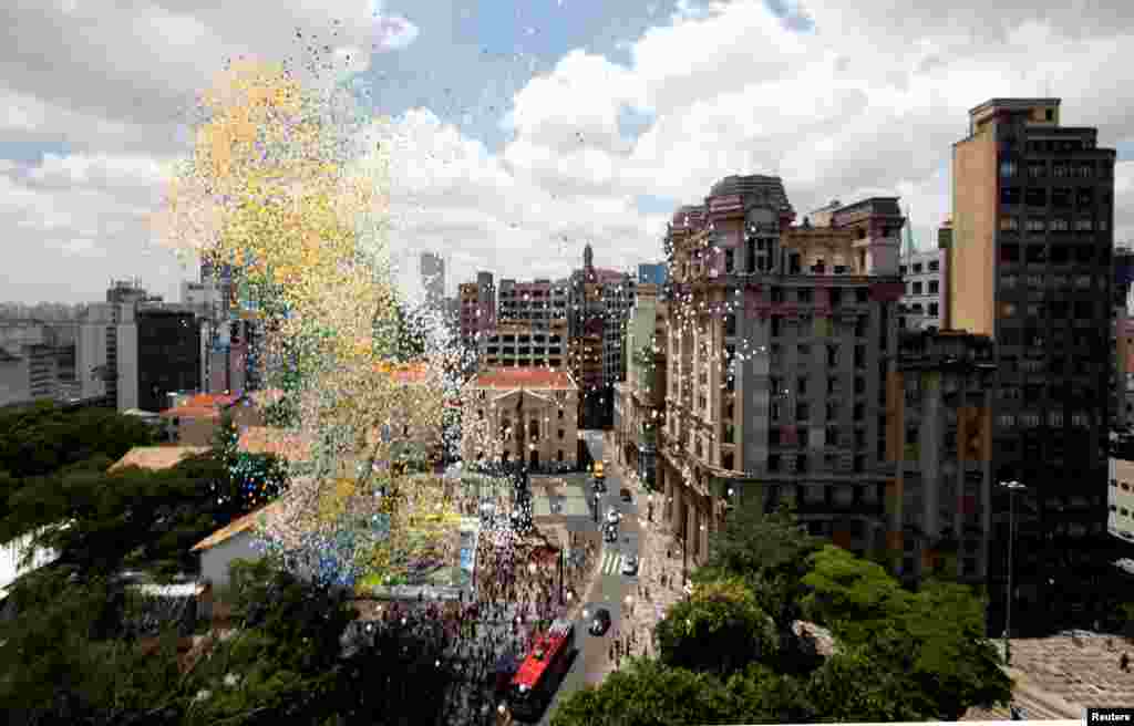 Balloons are released into the sky as part of the year-end celebrations in downtown Sao Paulo, Brazil.