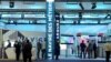 FILE - People visit the Navire des Metiers stand at Euronaval 2018, a naval defense equipment fair, in Le Bourget, near Paris, Oct. 23, 2018. 