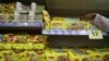 A worker arranges packets of Nestle's Maggi noodles on a shelf inside a Reliance supermarket in Mumbai, India, March 16, 2021.