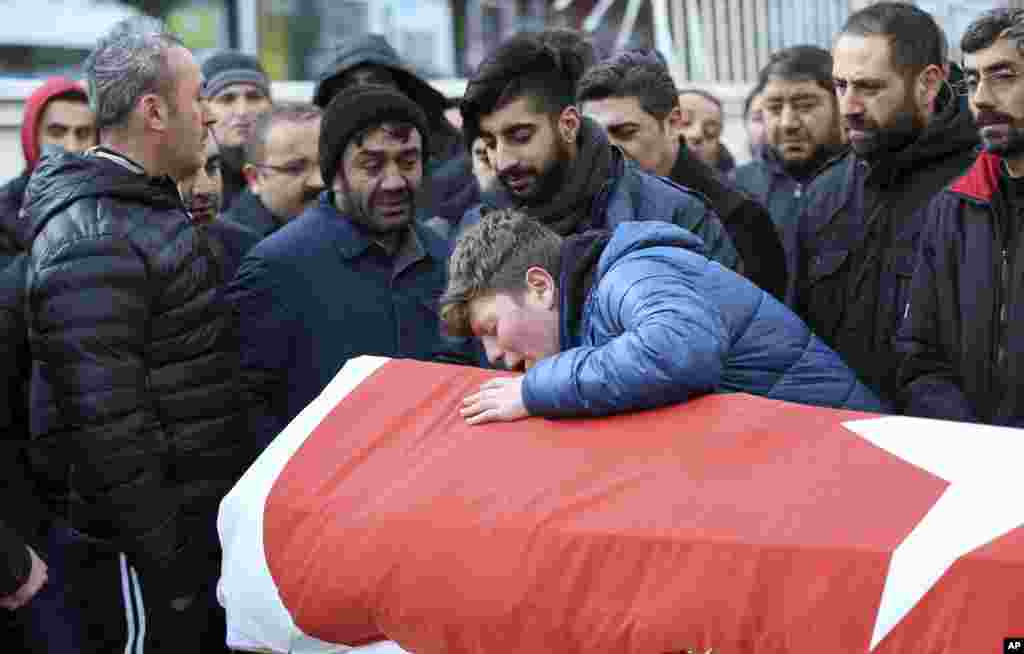 Family members and friends mourn as they attend funeral prayers for Ayhan Akin, one of the nightclub victims, in Istanbul, Turkey. An assailant believed to have been dressed in a Santa Claus costume and armed with a long-barreled weapon, opened fire at a nightclub in Istanbul's Ortakoy district during New Year's celebrations, killing dozens of people and wounding dozens of others in what the province's governor described as a terror attack.