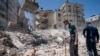 Heavy construction equipment is used to sift through rubble of a building destroyed in Israeli an airstrike on in Gaza City prior to a cease-fire that halted an 11-day war between Gaza and Israel, May 27, 2021.