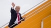 U.S. President Donald Trump waves as he leaves Danang for Hanoi, Vietnam, after attending the Asia-Pacific Economic Cooperation (APEC) Summit, Nov. 11, 2017.