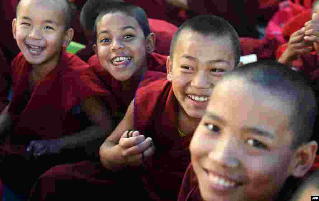 Young Buddhist monks participate in a special religious teaching prayer attended by the Tibetan spiritual leader, The Dalai Lama during the Kalachakra event at Bodhgaya.
