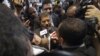 Mohamed Morsi, the Muslim Brotherhood's presidential candidate, is surrounded by reporters in Cairo, Egypt, May 26, 2012.
