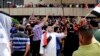 Supporters of Shi'ite cleric Muqtada al-Sadr chant slogans calling for governmental reforms as they wave national flags before ending their sit-in inside Baghdad's highly fortified Green Zone, May 1, 2016.
