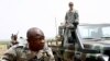 Malian special forces drill to face off an ambush as an unidentified U.S. Special Forces soldier gives instructions from a Malian truck in Kita, Mali, during a joint training exercise, May 10, 2010 (file photo). 