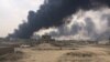 Just days ago, Islamic State militants were operating on the outskirts of Qayyarah setting fire to oil wells they controlled only a month ago, Oct. 24, 2016. (H. Murdock/VOA)