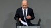 German Chancellor Olaf Scholz speaks during a plenary session at the German parliament before facing a no-confidence vote, in Berlin, Germany, Dec. 16, 2024.
