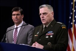 Defense Secretary Mark Esper, left, and Chairman of the Joint Chiefs of Staff Army Gen. Mark Milley, right, during a briefing at the Pentagon in Washington, March 2, 2020.