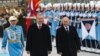 Russia's President Vladimir Putin, right, and Turkey's President Recep Tayyip Erdogan review an honor guard during a welcoming ceremony at the Presidential Palace in Ankara, Dec. 1, 2014. 