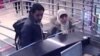 Security camera video footage obtained by Haberturk television on Jan. 12, 2015, shows Hayat Boumeddiene and a male travel companion arriving at Istanbul's Sabiha Gokcen airport on Jan. 2, 2015.