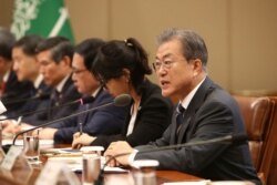 South Korean President Moon Jae-in, right, talks with Saudi Crown Prince Mohammed bin Salman, not pictured, at the presidential Blue House, June 26, 2019, in Seoul.
