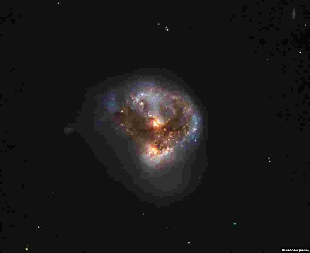 This megamaser is named IRAS 16399-0937, and is located over 370 million light-years from Earth. This NASA/ESA Hubble Space Telescope image belies the galaxy’s energetic nature, instead painting it as a beautiful and serene cosmic rosebud.