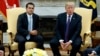 President Donald Trump speaks during a meeting with Governor Ricardo Rossello of Puerto Rico in the Oval Office of the White House, Oct. 19, 2017, in Washington. 