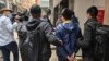 香港民主派议员钟锦麟（右二）在1月6日的大抓捕中被警方逮捕（资料图）