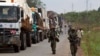 African Union (AU) peacekeepers guard a commercial convoy making its way to the border of Cameroon, near Bangui, March 8, 2014.