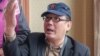 Yang Hengjun, author and former Chinese diplomat, who is now an Australian citizen, gestures in an unspecified location in Tibet, China, in mid-July 2014, in this social media image.