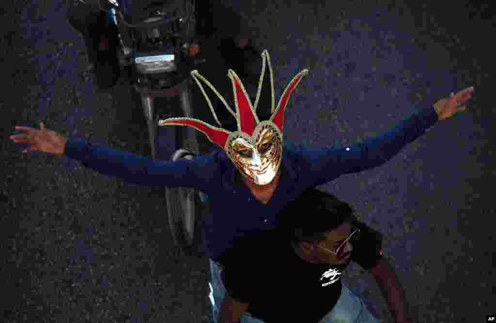 A Pakistani Christian wears mask during a Christmas celebration in Karachi.