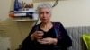 Raja Banout is teaching other Syrian refugee women to overcome pain and disorientation with song. (J. Dettmer/VOA)