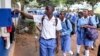 FILE - Students sign out for classes at Wampewo Ntakke Secondary School in Kawempe tula village, Kampala, Uganda, on Nov. 4, 2024. 