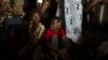 A performer from the Mangueira samba school parades during carnival celebrations at the Sambadrome in Rio de Janeiro, Brazil.
