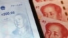 中国数字货币在手机上的官方应用程序与人民币百元钞。（2020年10月16日）