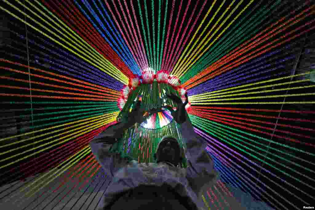 A man decorates a church ahead of Christmas celebrations in Ahmedabad, India, Dec. 18, 2016.