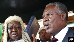 Zambia's new President Michael Sata, right, takes the oath of office on the steps of the supreme court in Lusaka (file photo).