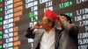 Filipino traders blow horns during the last trading day of the year at the Philippine Stock Exchange in the financial district of Makati, south of Manila, Philippines, Dec. 29, 2016. 