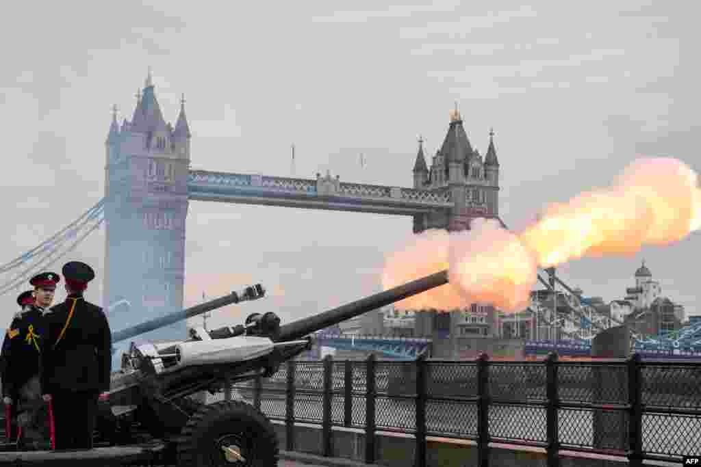 Members of the Honourable Artillery Company fire a 62 round royal gun salute from the Gun Wharf outside the Tower of London to mark the anniversary of Queen Elizabeth II's accession to the throne in London.