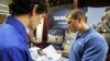 Skanska USA recruiter, Tony DeStefano, (right) talks to Virginia Tech senior, Chris Kervan of Richmond, Virginia, at a Career Fair. 