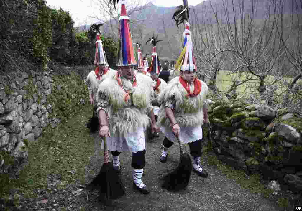 Bellringers, known as "Joaldunak" in Basque language march with big cowbells hanging on their back during the ancient carnival of Ituren, in the northern Spanish Navarra province.