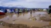 Torrential rains have flooded parts of the makeshift refugee camp in the Greek village of Idomeni, near the border with Macedonia. Inhospitable weather adds to the migrants' anxieties. (J. Dettmer/VOA)