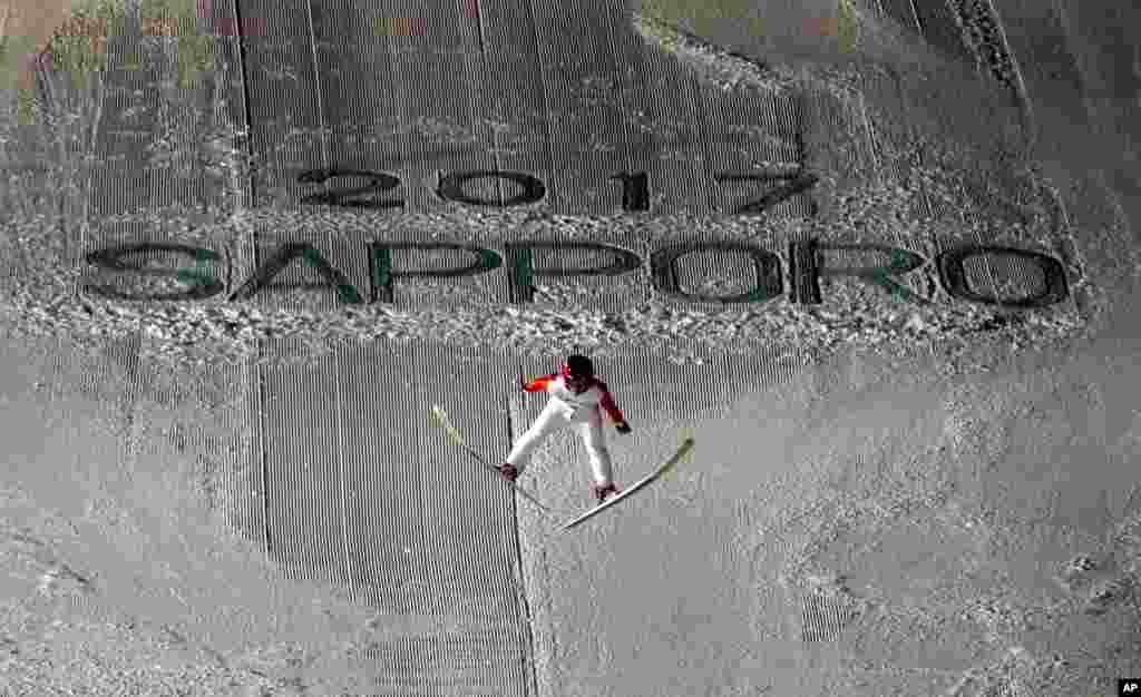 Japan&#39;s Naoki Nakamura soars through the air in his second round jump at the ski jumping men&#39;s large hill individual at the Asian Winter Games in Sapporo, northern Japan.