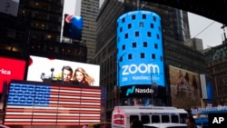 FILE - Nasdaq is ready for the Zoom IPO, in New York, April 18, 2019. The videoconferencing company is headquartered in San Jose, California. 