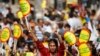 FILE - A Kurdish woman holds a sign that reads "Don't ban my language" during a rally in Diyarbakir, Turkey, Sept. 1, 2009.