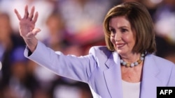 FILE - Former U.S. House Speaker Nancy Pelosi waves during the Democratic National Convention in Chicago, Illinois, Aug. 21, 2024. She had successful emergency hip-replacement surgery on Dec. 14, 2024, after being injuries during a visit to Luxembourg.