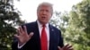 FILE - President Donald Trump talks with reporters before departing on Marine One for the Air Force Academy graduation ceremony, May 30, 2019, in Washington.