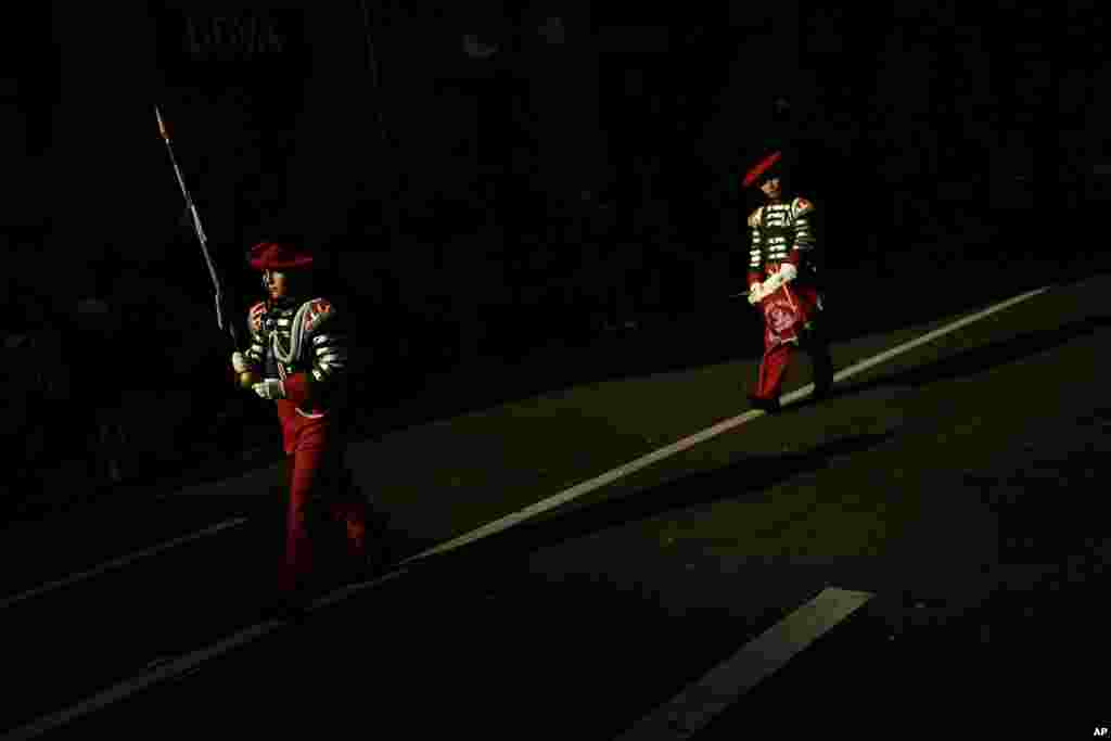 "Tamborilleros," wearing their uniforms, march in the traditional ' La Tamborrada,' during 'El Dia Grande,' the main day of San Sebastian feasts, in the Basque city of San Sebastian, northern Spain.