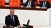 FILE - Turkey's Deputy Prime Minister Bulent Arinc addresses the Turkish Parliament in Ankara in a 2013 photo.