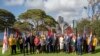 Britain's Prince Harry, center, and his wife Meghan, the Duchess of Sussex, center right, meet the Australian Governor-General Sir Peter Cosgrove and Lady Cosgrove, and representatives of Invictus Games participating countries in Sydney, Tuesday, Oct. 16, 2018. 