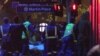 FILE - Armed tactical response officers and emergency workers attend the scene after a cafe siege in the central business district of Sydney , Australia.