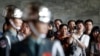 FILE - Honor guards perform in front of tourists from China at the Sun Yat-sen memorial in Taipei.