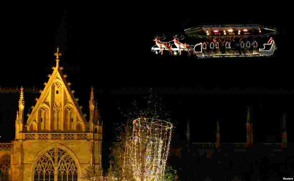 Guests enjoy dinner at the table "Santa in the sky", lifted by a crane and decorated to match the appearance of a "Santa Sleigh" as part as the Christmas festivities, in Brussels, Belgium.